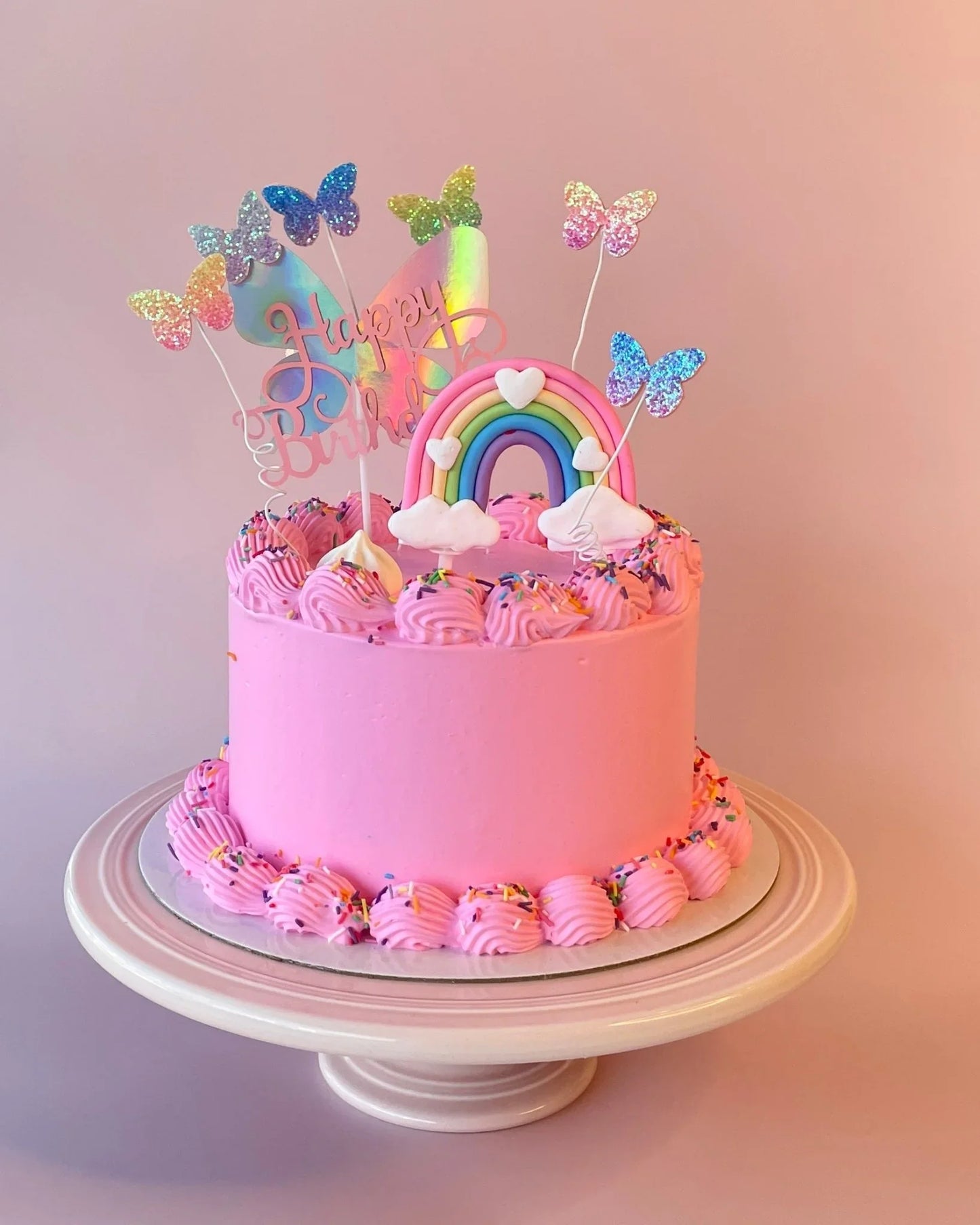Rainbow Butterfly birthday cake by Bannos, available as a sponge or gelato (ice cream) cake